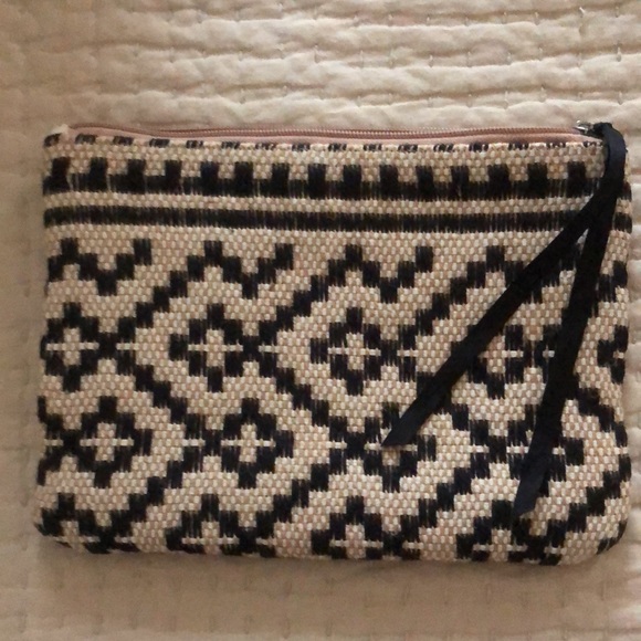 Mango clutch. Textured geometric pattern. Zip top w/ black grosgrain ribbon pull - Picture 4 of 11